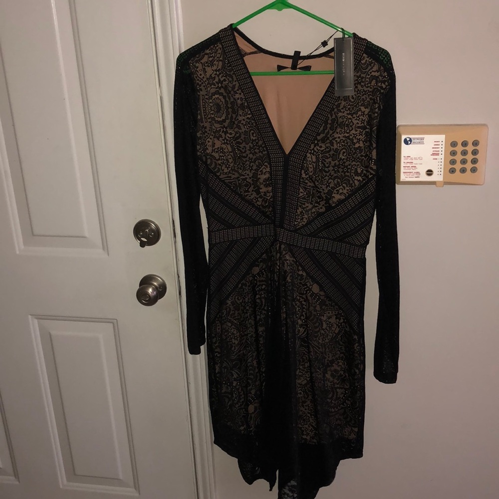 BCBG Size M Black lace dress. New with tags.